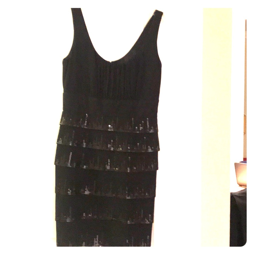 Black short dress with sequins.